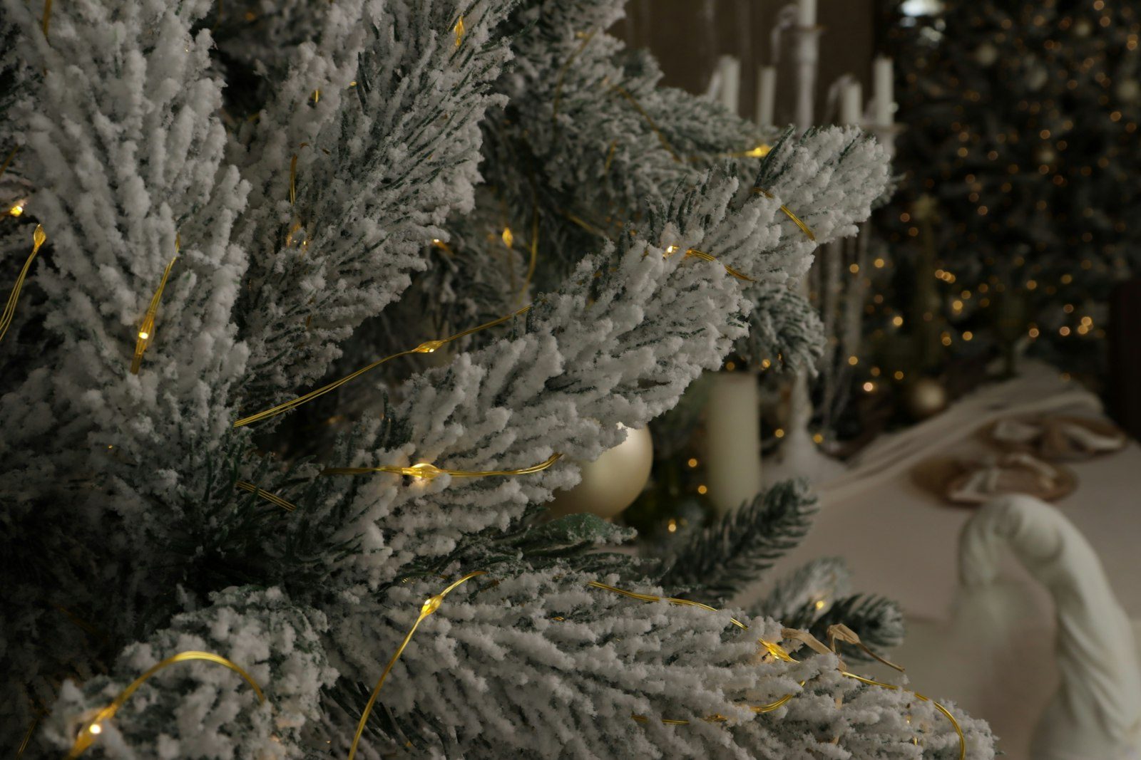 Flocked white Christmas tree with ornaments