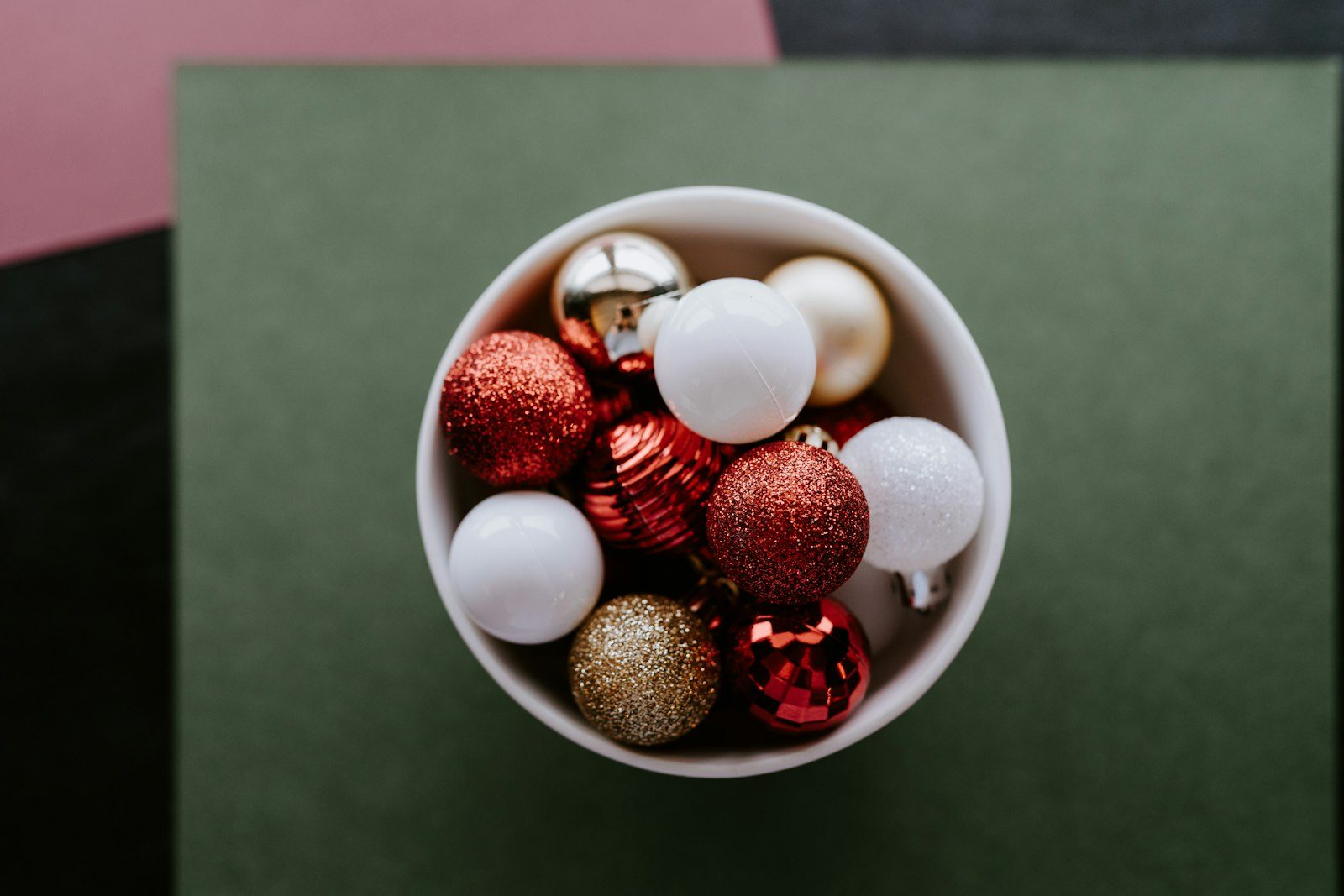 Glass bowl of Christmas ornaments as centerpiece